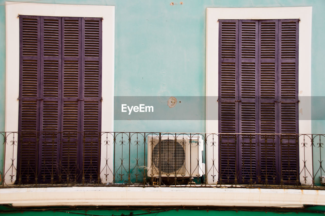 BUILDING EXTERIOR WITH CLOSED SHUTTER