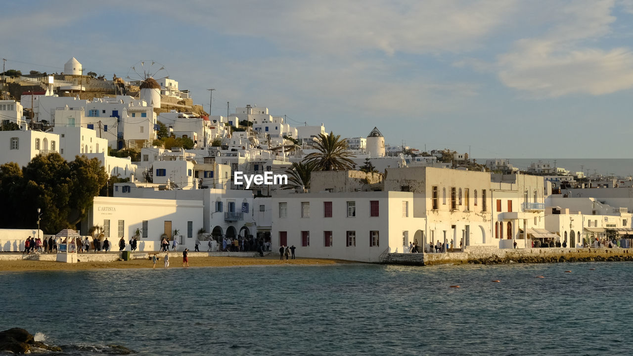 architecture, building exterior, water, built structure, building, sea, coast, city, sky, town, nature, travel destinations, residential district, vacation, travel, waterfront, land, house, tourism, harbor, beach, cityscape, cloud, outdoors, nautical vessel, transportation, no people, day, old, holiday, history, the past, trip, vehicle, coastline, community, place of worship, sunlight, religion, bay, body of water