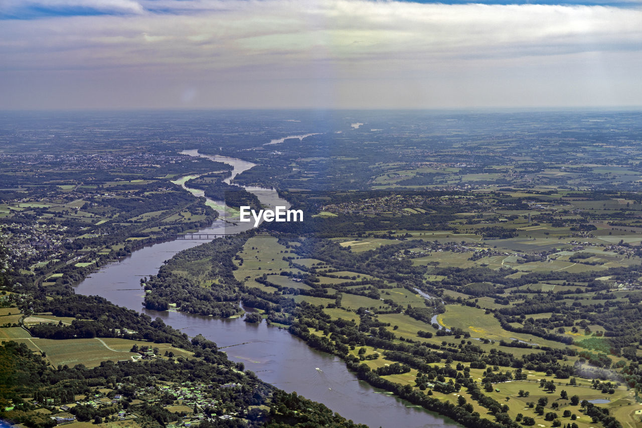 AERIAL VIEW OF RIVER AMIDST LANDSCAPE