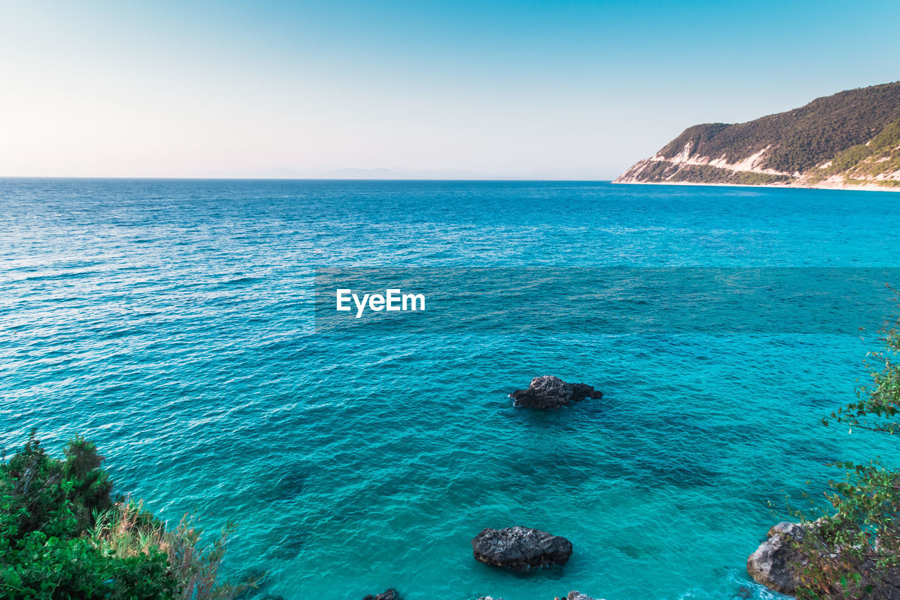 Scenic view of sea against clear sky