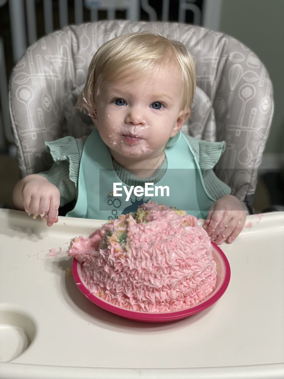 Portrait of cute girl eating food at home happy birthday