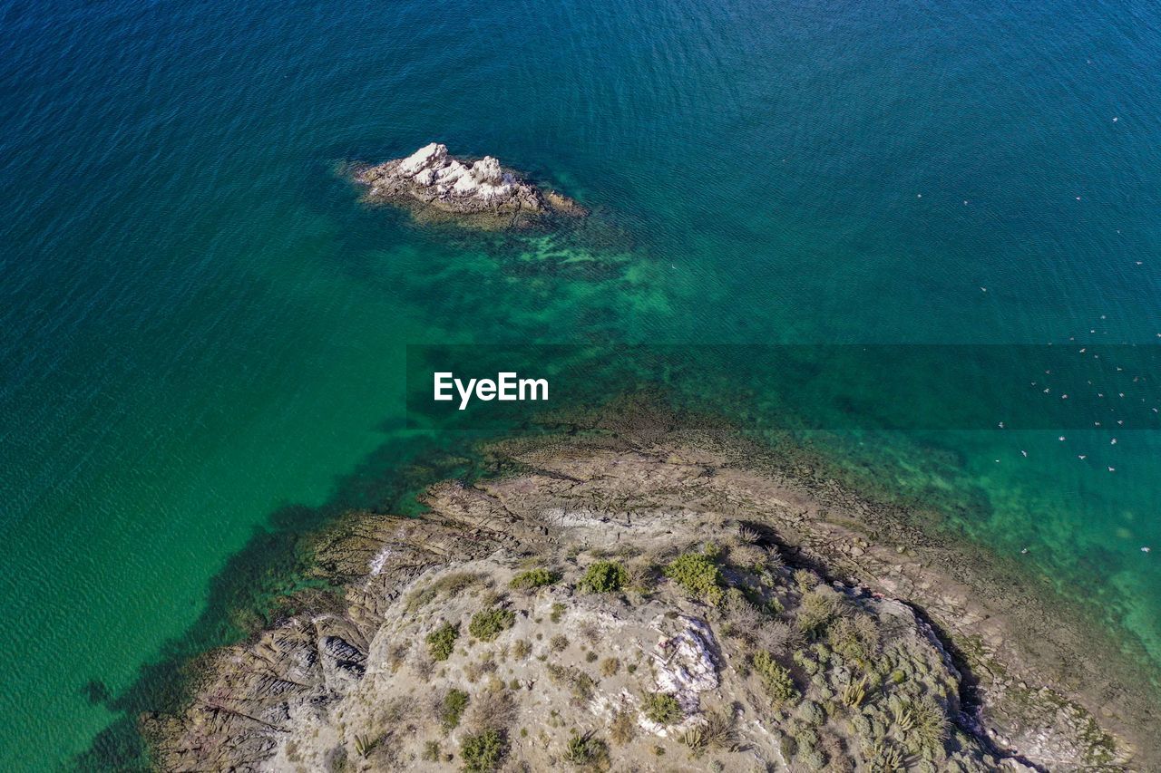 High angle view of rocks in sea