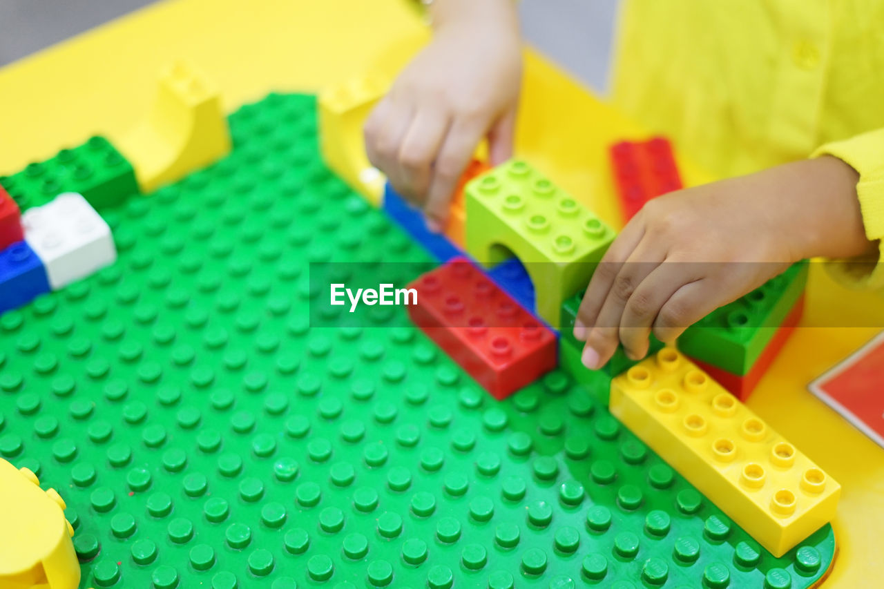 Girl playing with toy blocks