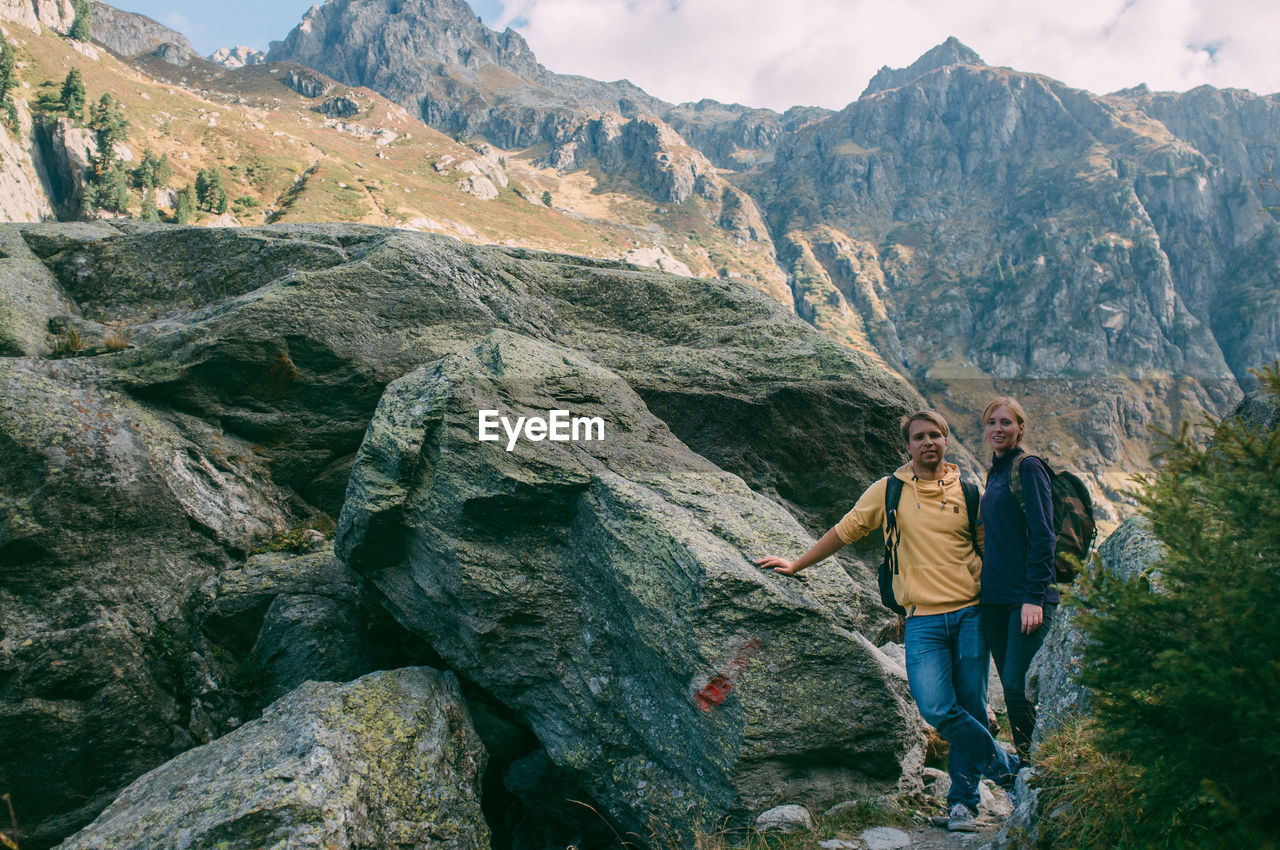 Young couple hiking in mountains