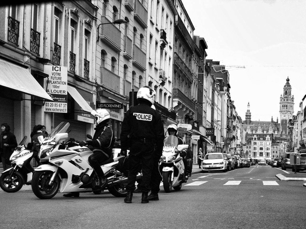 VIEW OF CITY STREET WITH BUILDINGS IN BACKGROUND