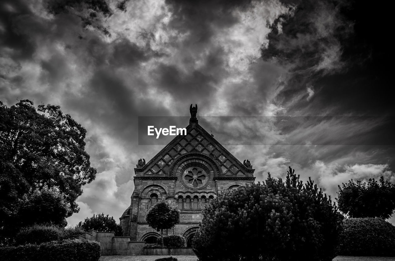 VIEW OF CHURCH AGAINST CLOUDY SKY