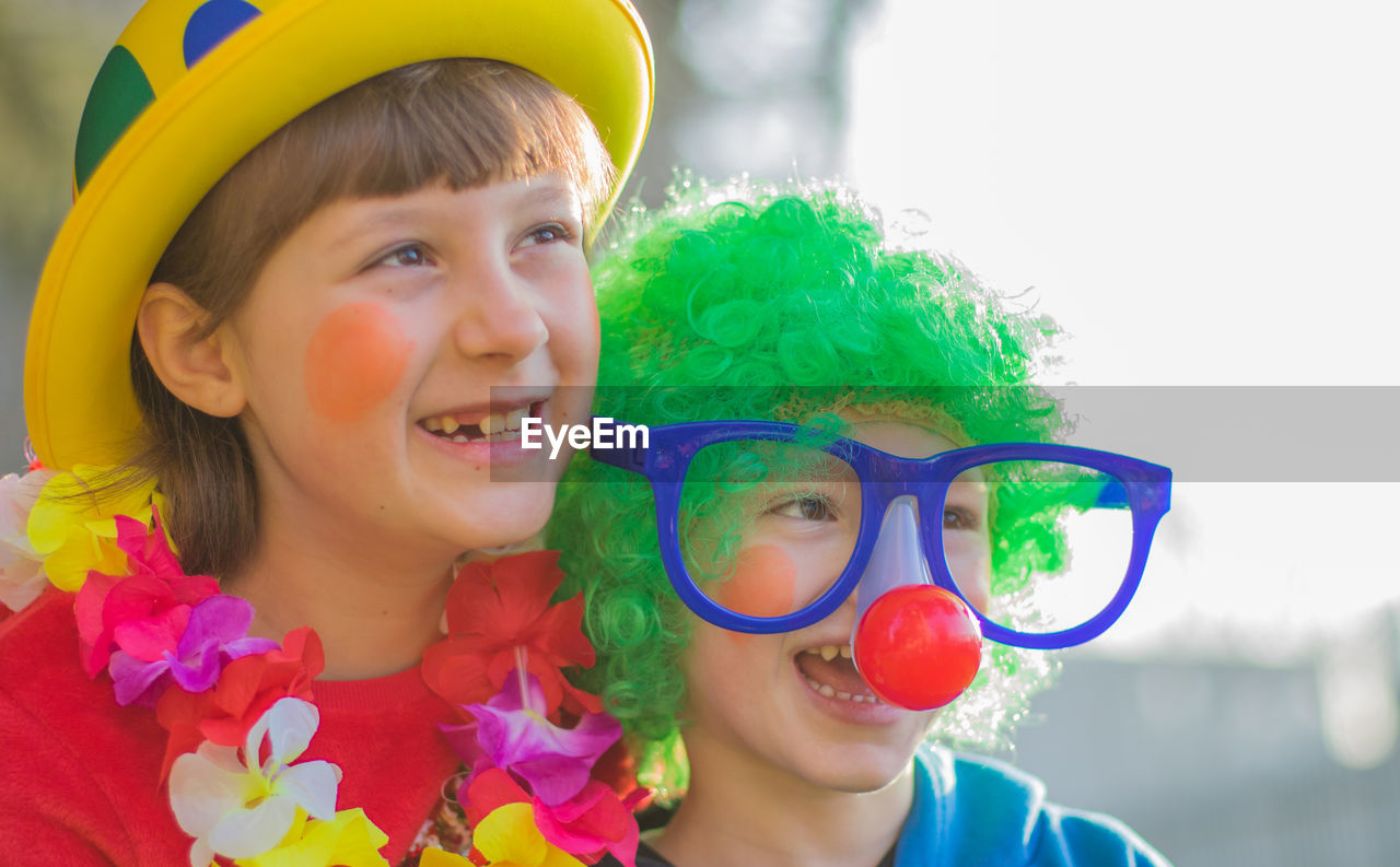 Smiling children wearing costumes during event