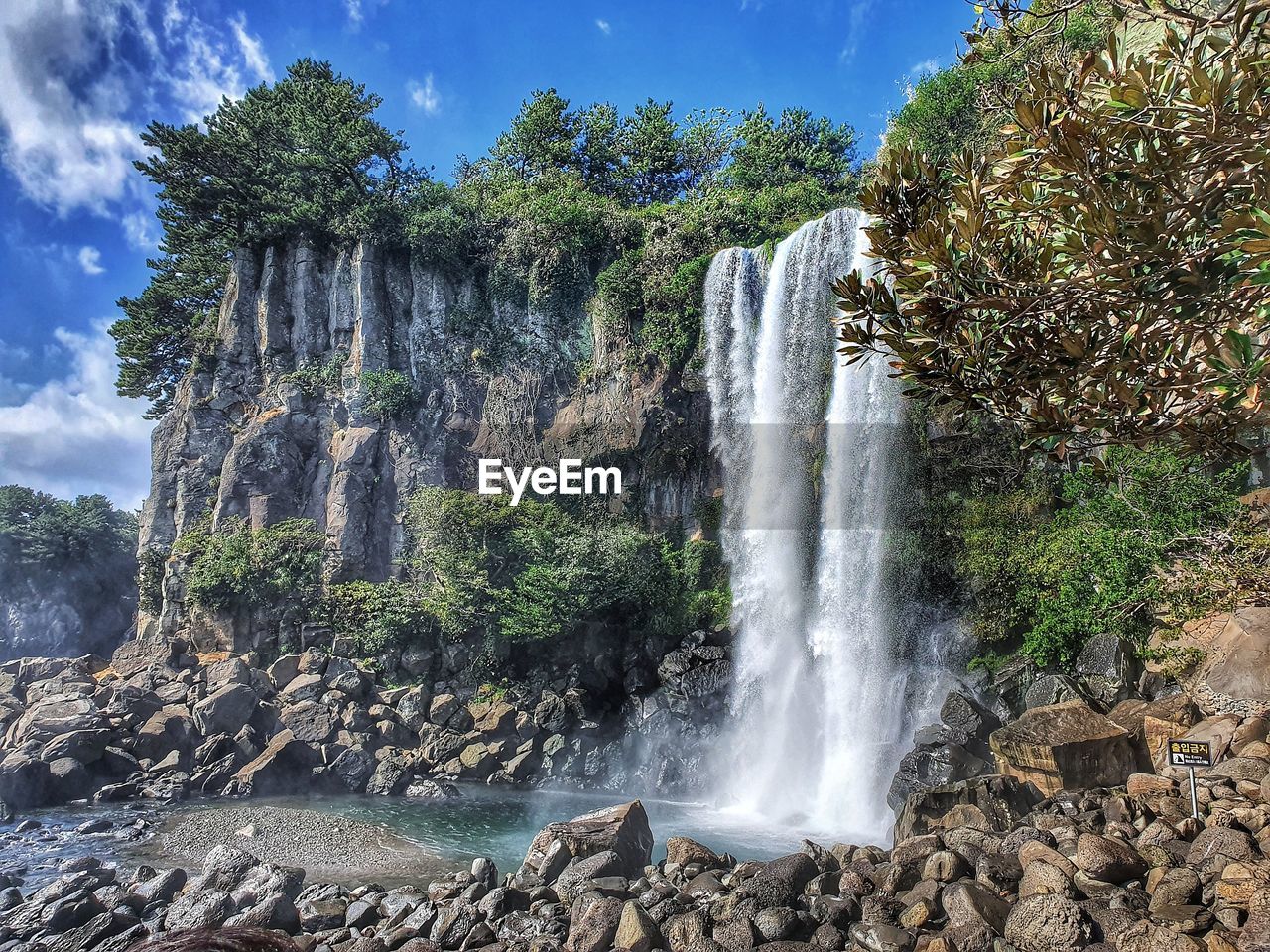 VIEW OF WATERFALL ON ROCKS