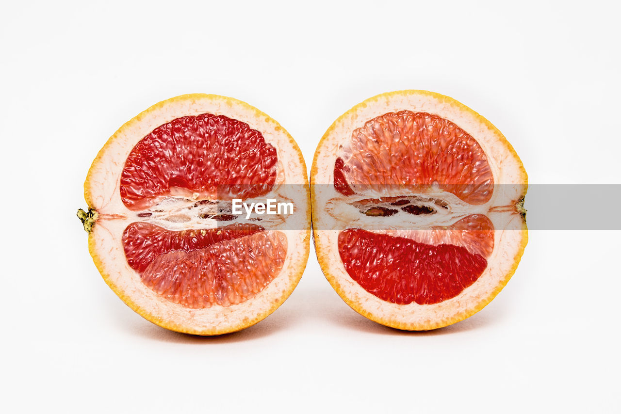 CLOSE-UP OF FRUITS IN WHITE BACKGROUND