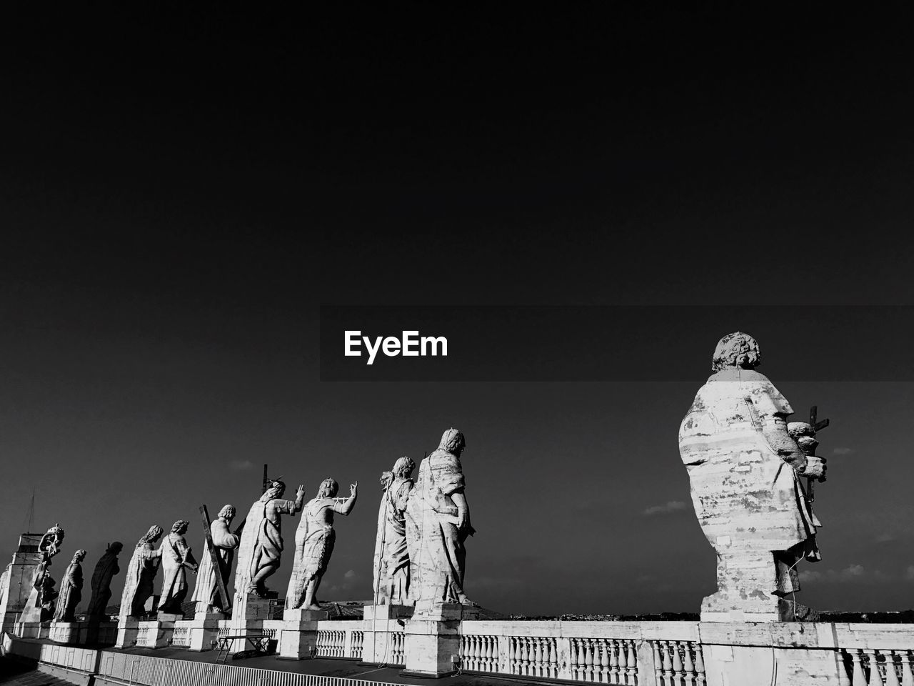 Low angle view of statues against sky