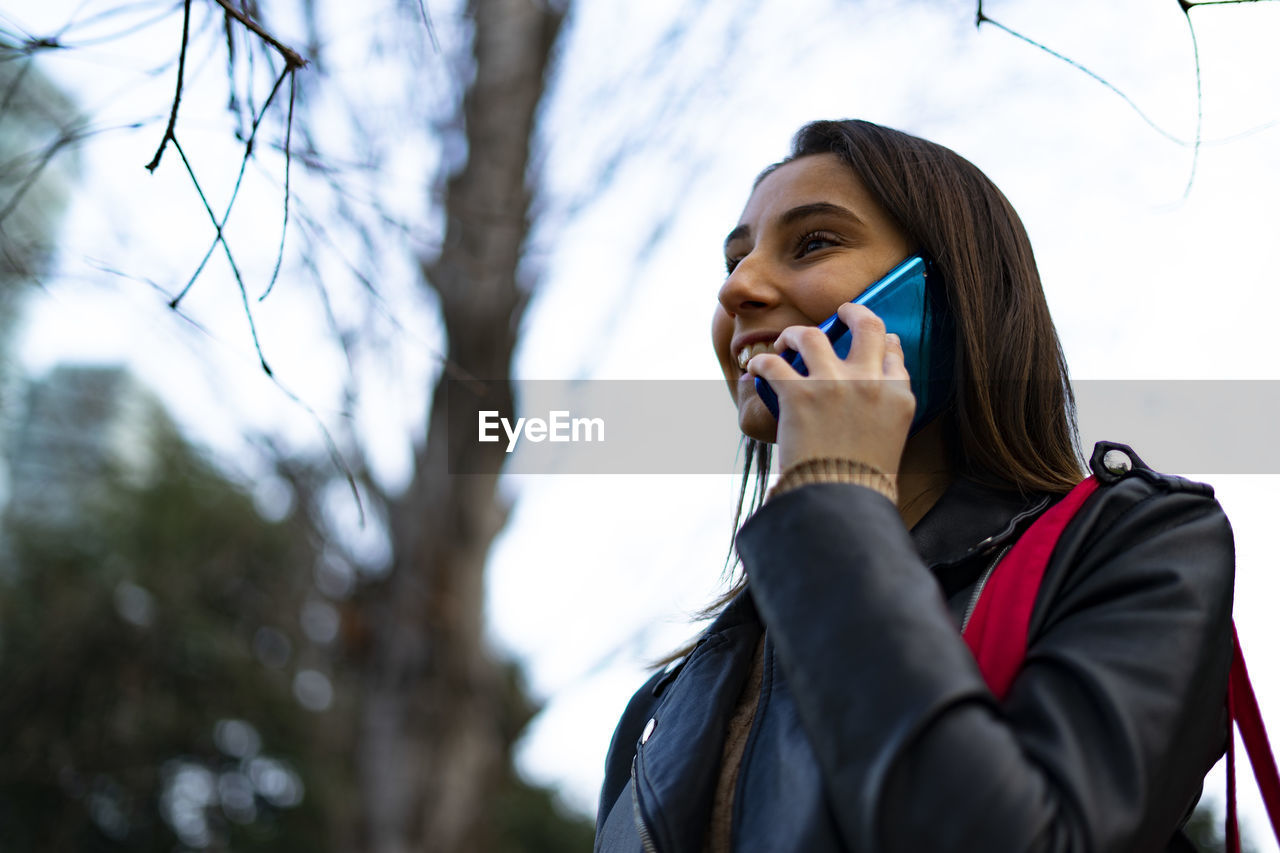 Lesbian woman talking on the phone.