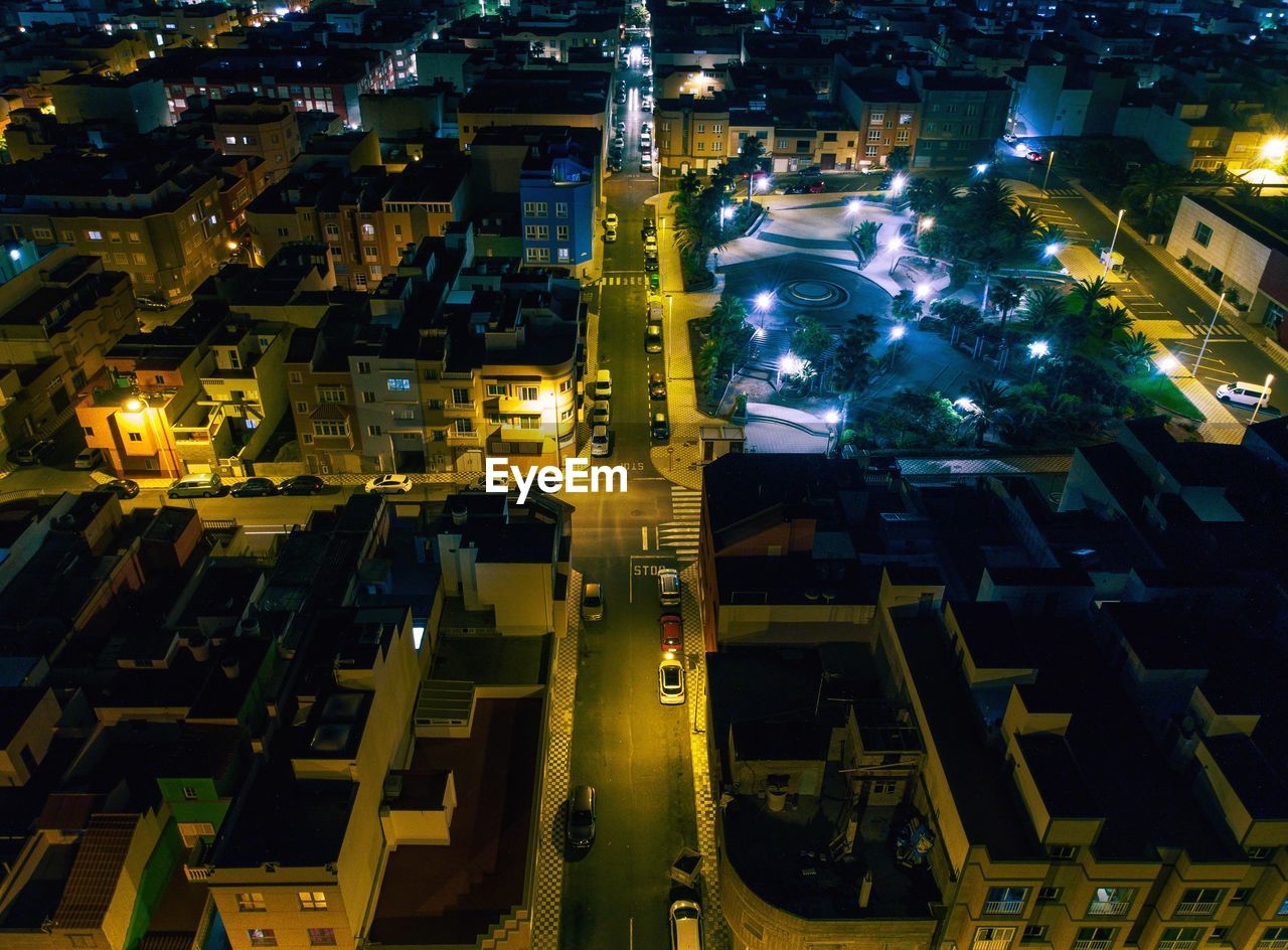 HIGH ANGLE VIEW OF ILLUMINATED CITY STREET