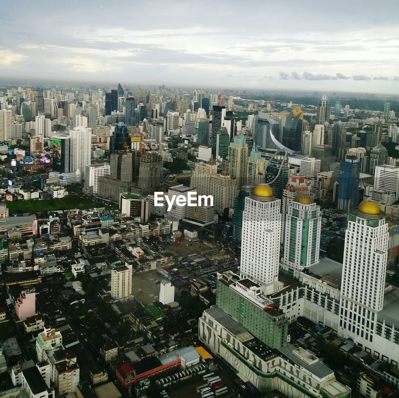 High angle view of modern buildings in city against sky