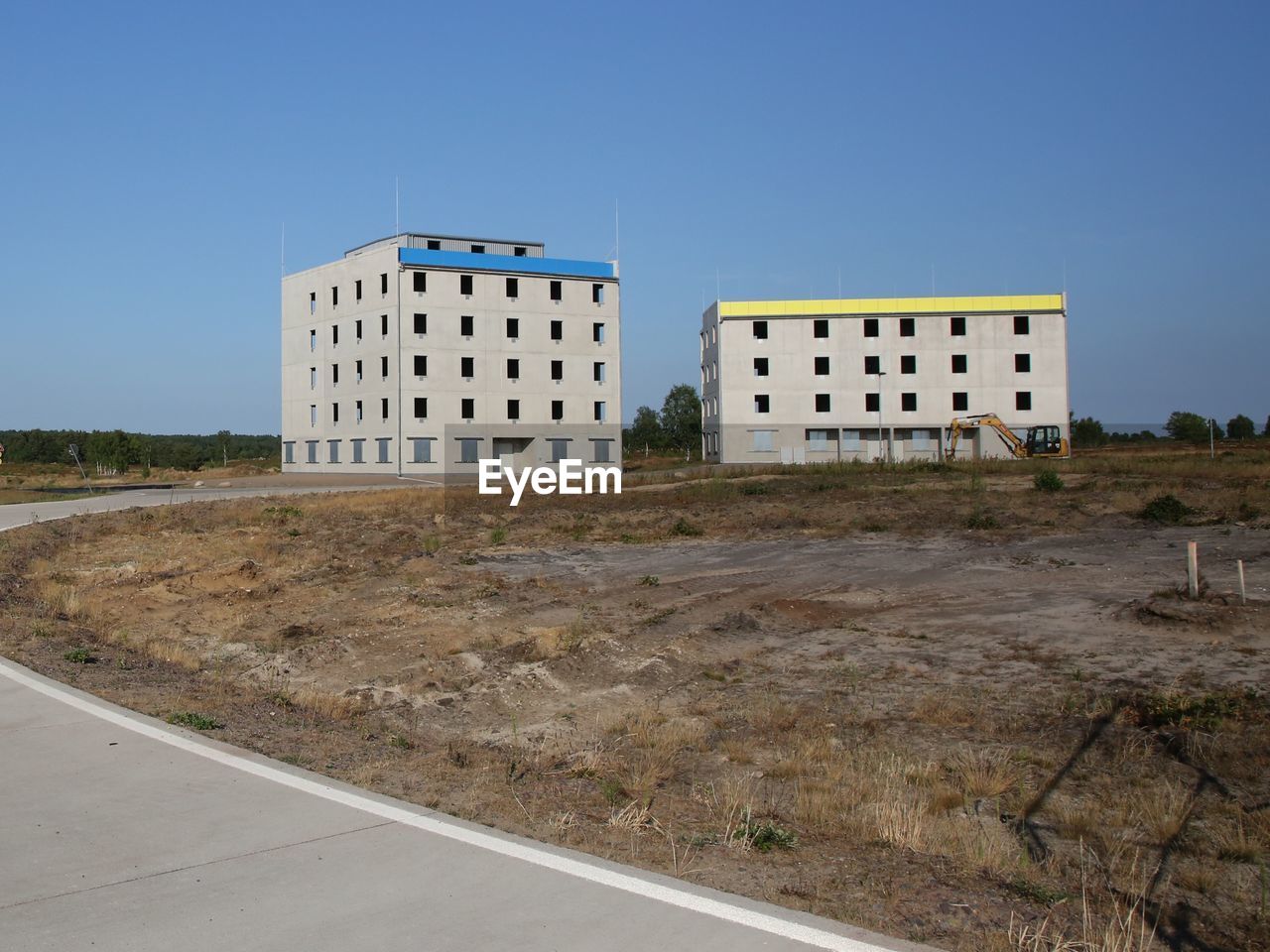 BUILDING AGAINST CLEAR BLUE SKY