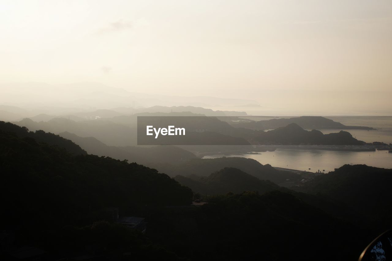 Scenic view of mountains against sky during sunset