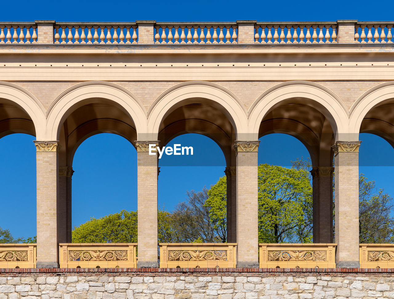 Low angle view of historical building against blue sky