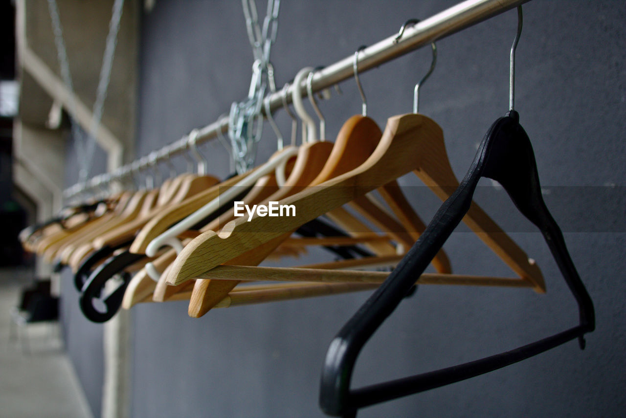 CLOSE-UP OF EMPTY HANGING ON RACK