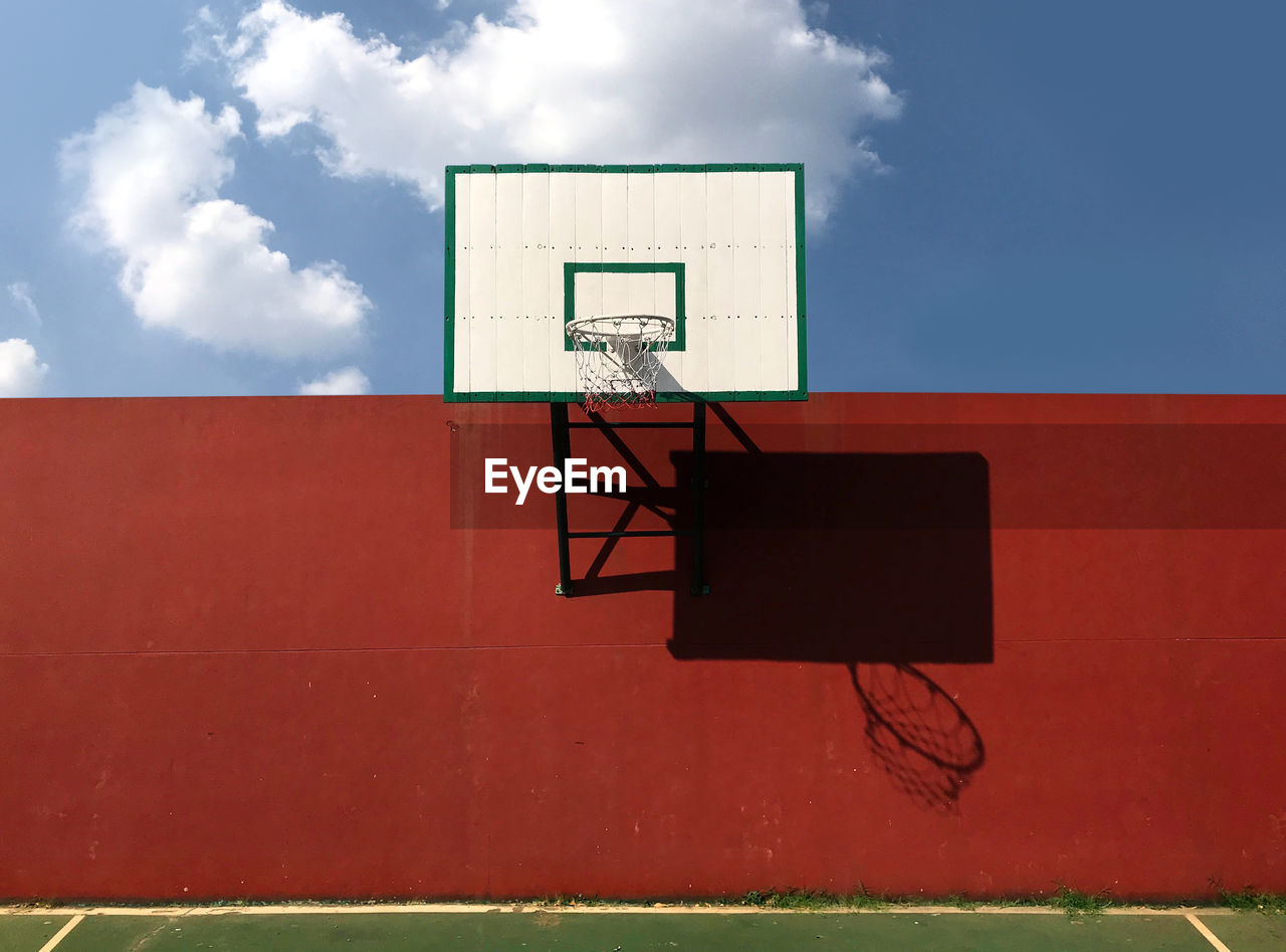 Low angle view of basketball hoop against sky