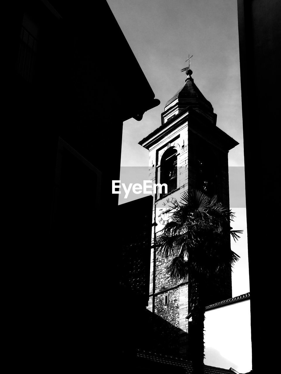 LOW ANGLE VIEW OF CLOCK AGAINST SKY