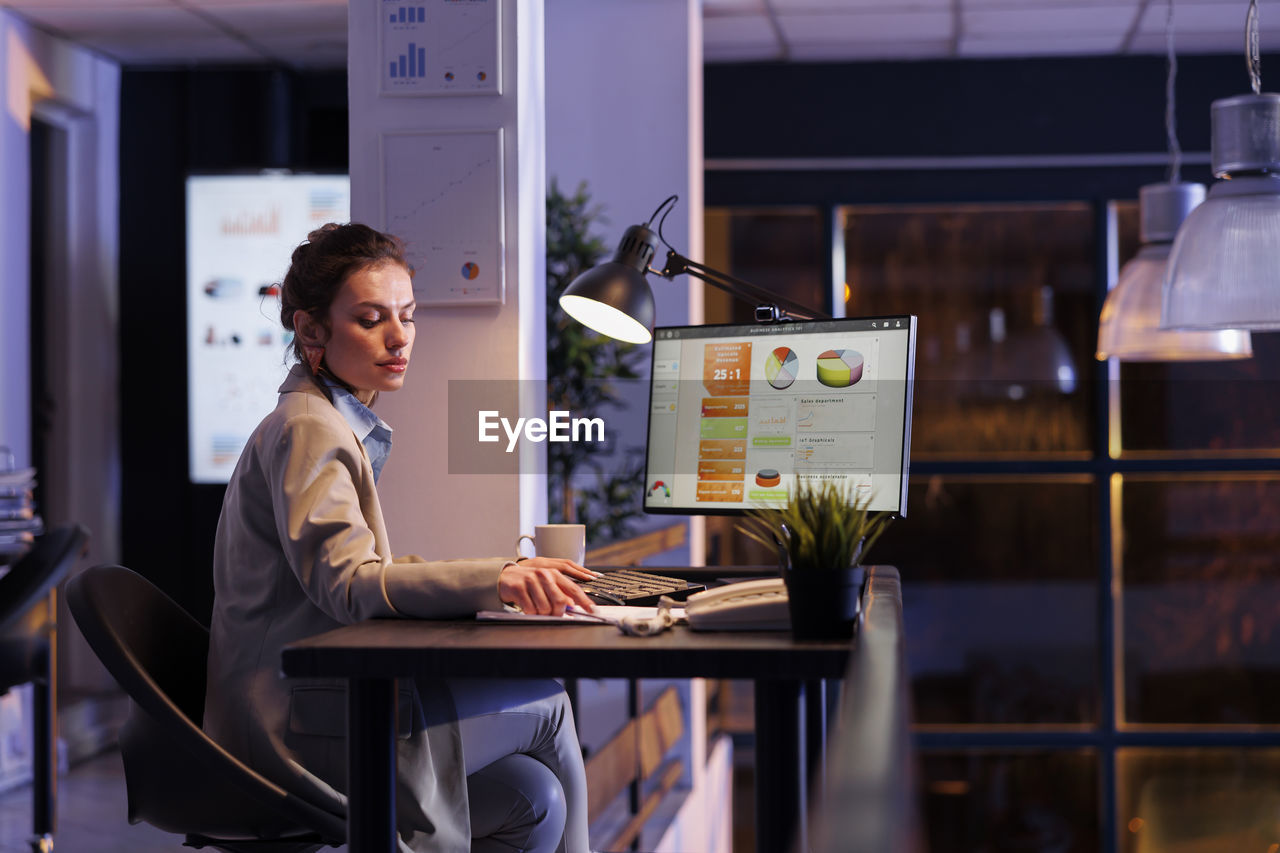 business colleagues working at desk in creative office