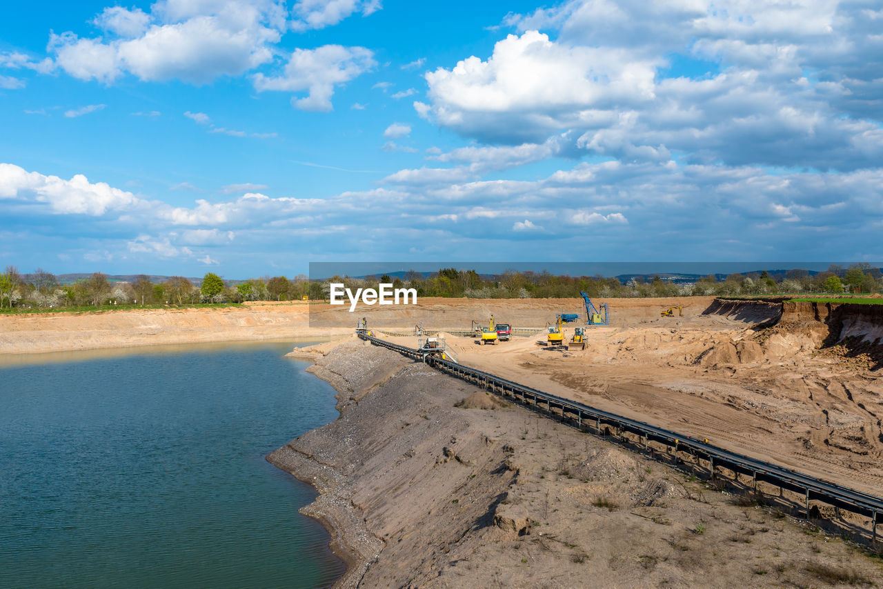 A string of transport belting in a gravel pit for transporting gravel and sand over long distances