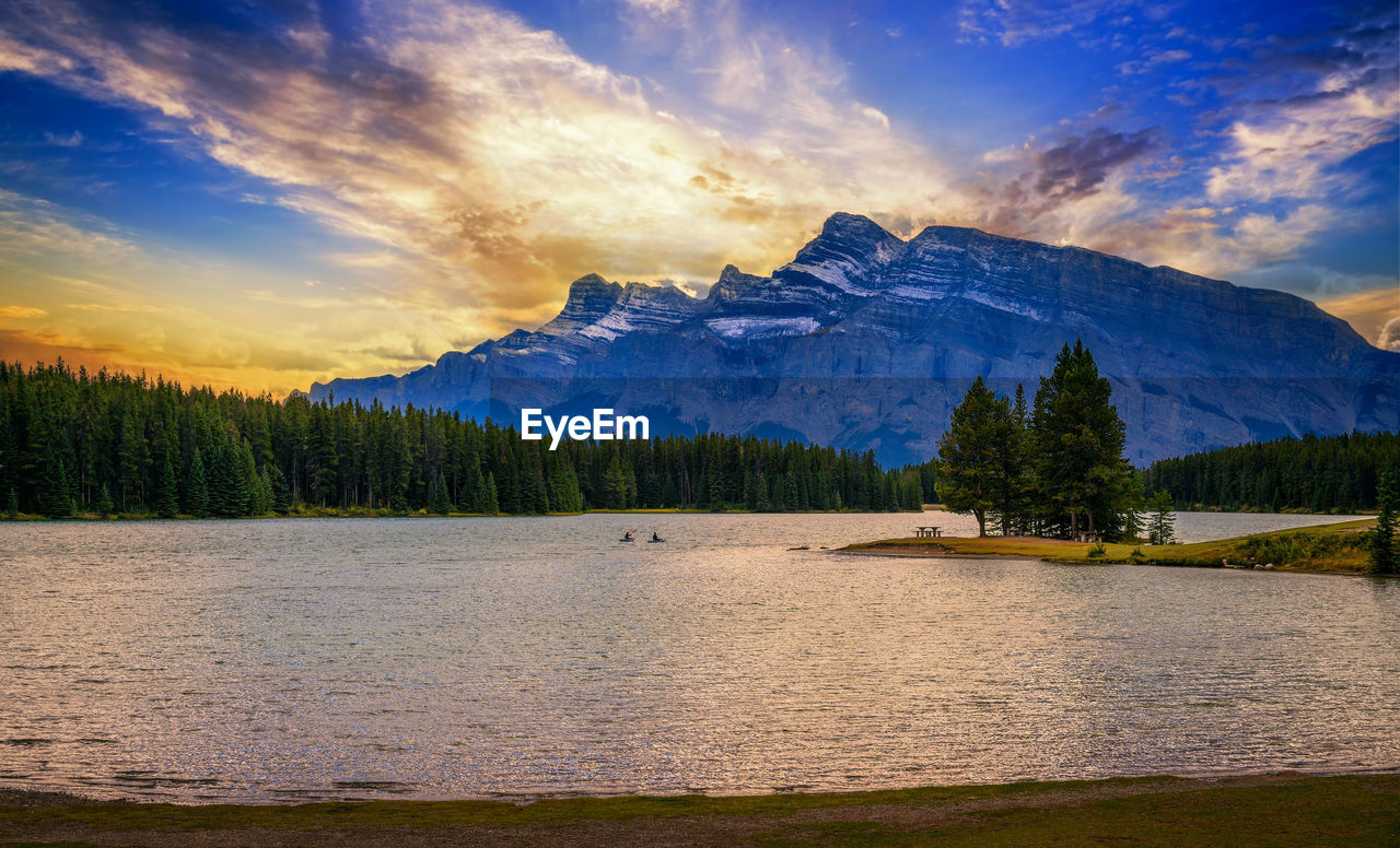 scenic view of lake against sky during sunset