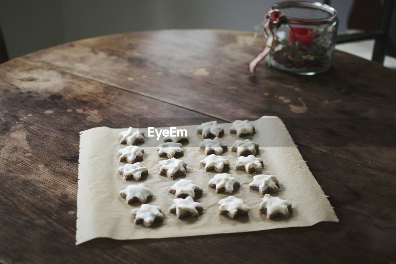 High angle view of star shaped cookies on paper at home