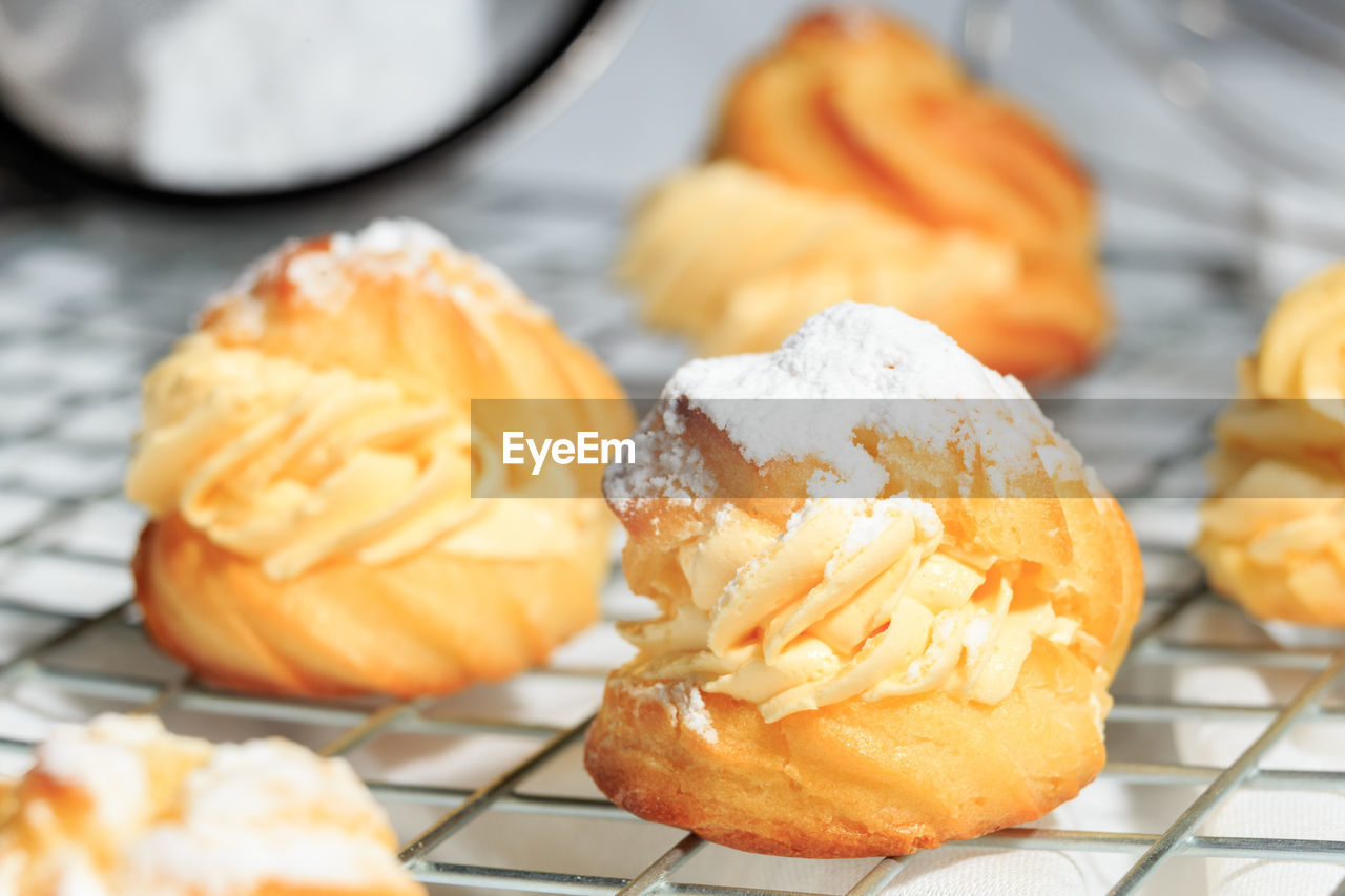 food, food and drink, sweet food, freshness, sweet, dessert, baked, produce, dish, no people, close-up, fruit, indoors, cooling rack, snack, focus on foreground, cuisine, meal, pastry, temptation, selective focus, unhealthy eating