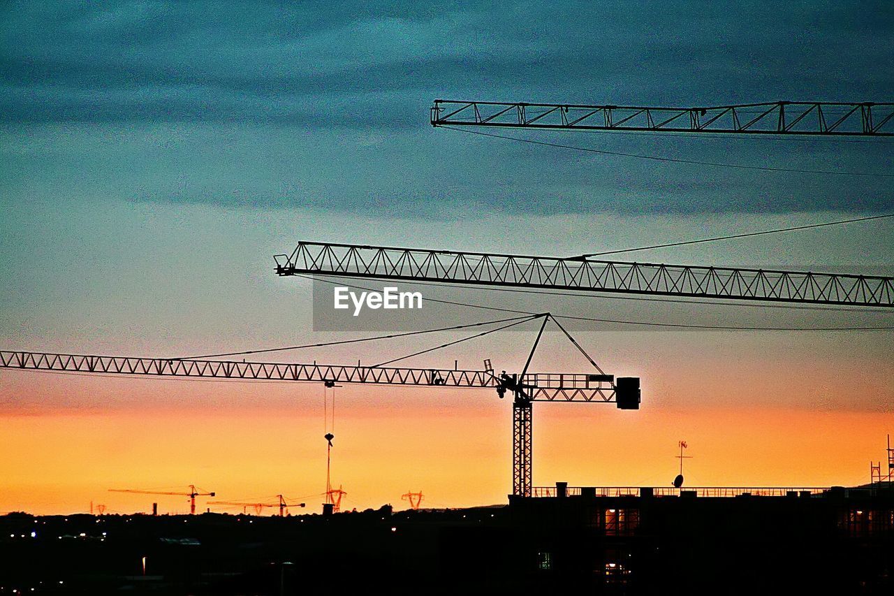 LOW ANGLE VIEW OF CONSTRUCTION SITE AGAINST SKY