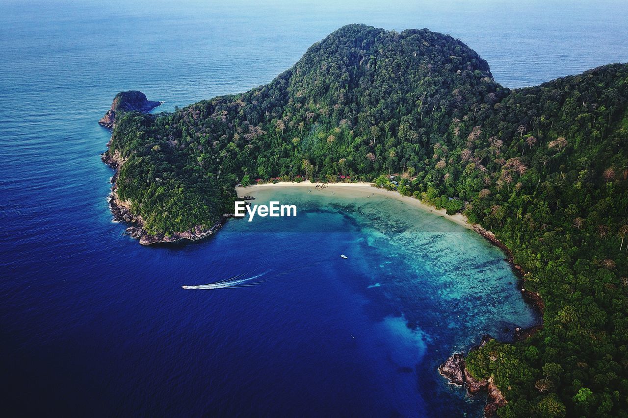 High angle view of sea against blue sky