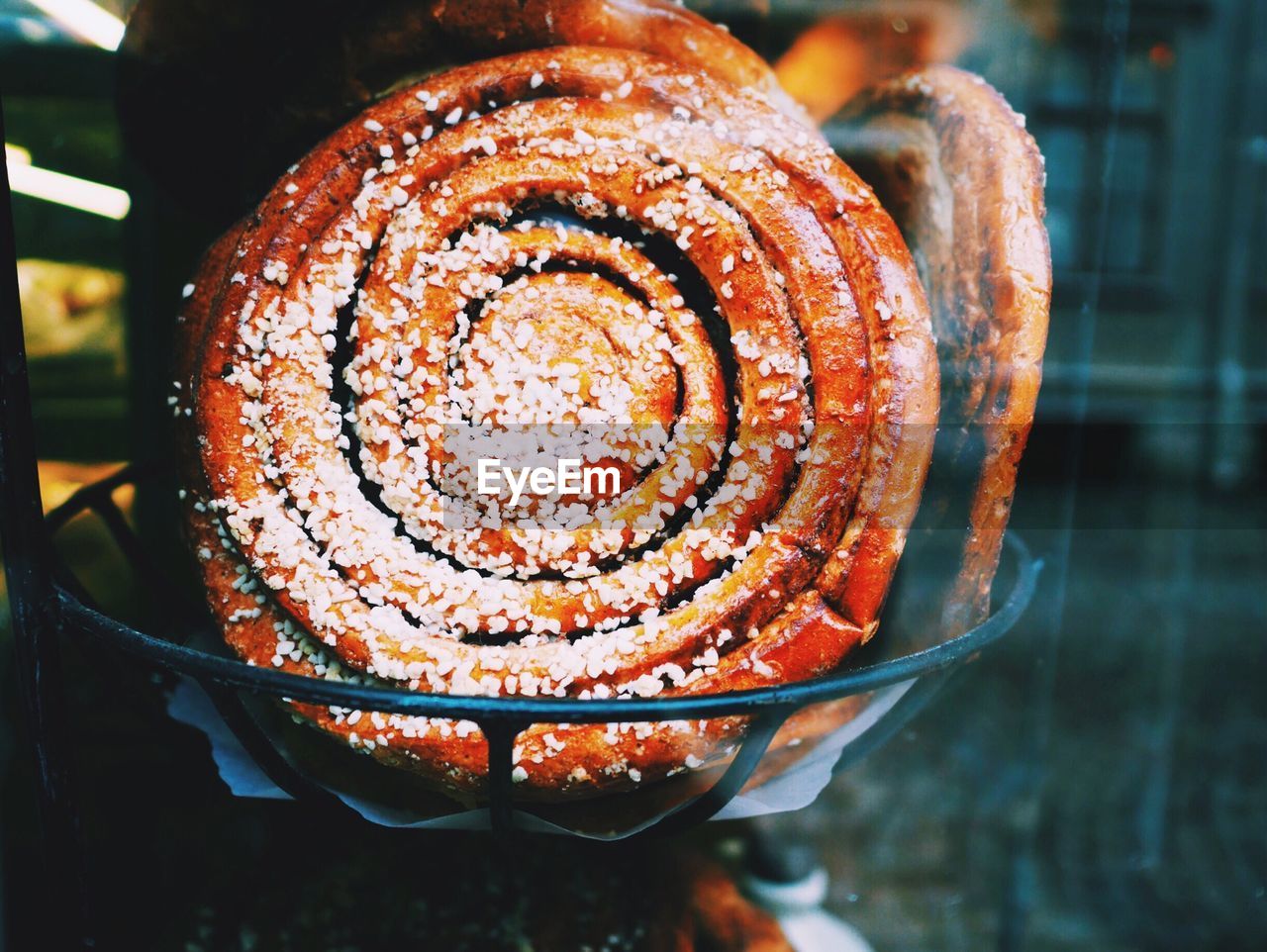 Close-up of cinnamon bun in bowl on table