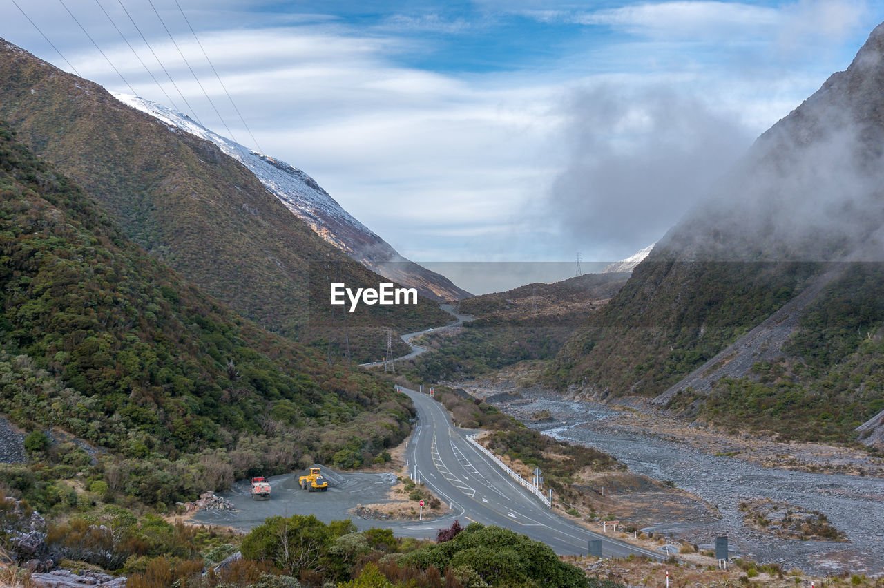 High angle view of road amidst mountains against sky