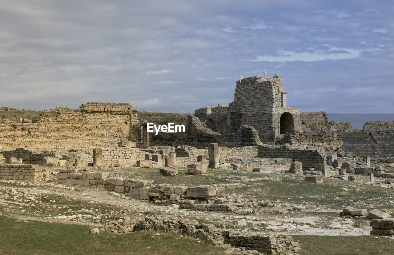 low angle view of old ruins against sky