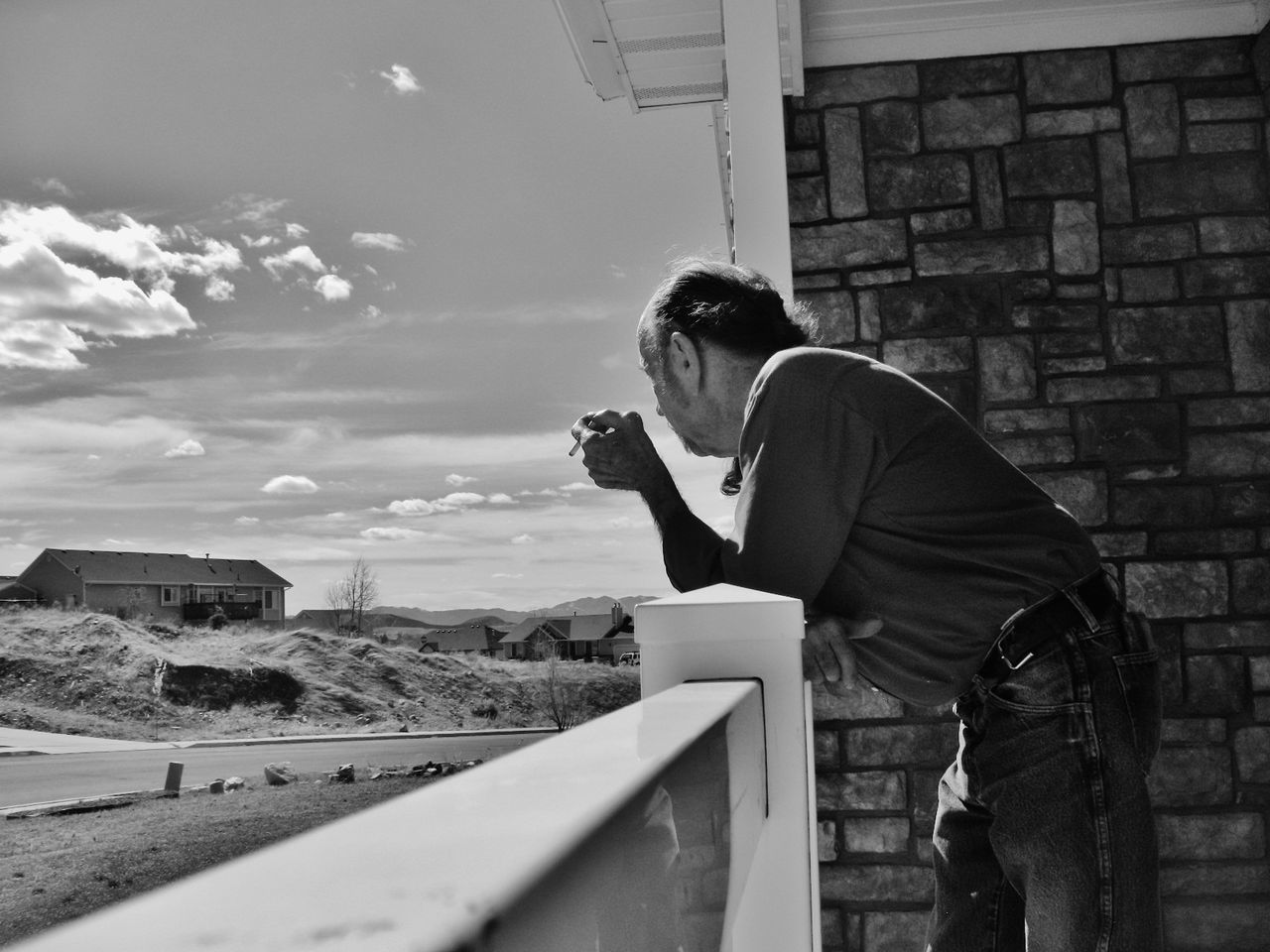 MAN STANDING AGAINST THE WALL