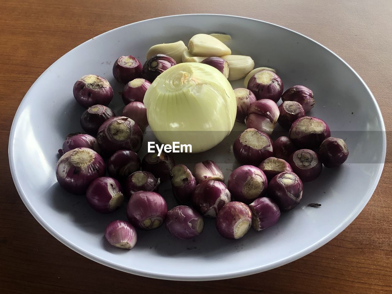 High angle view of onions in plate on table