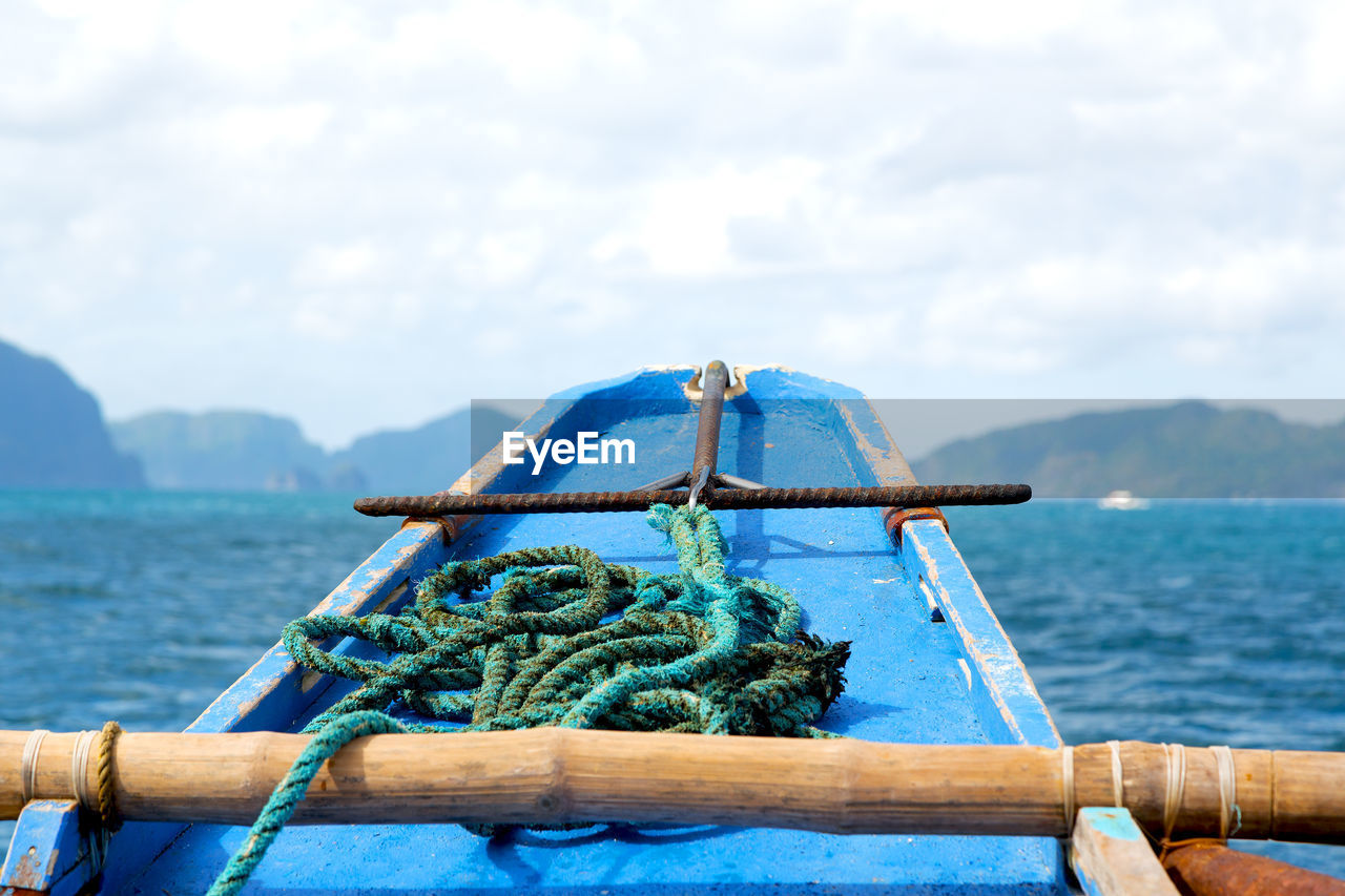 CLOSE-UP OF ROPE TIED ON SHIP