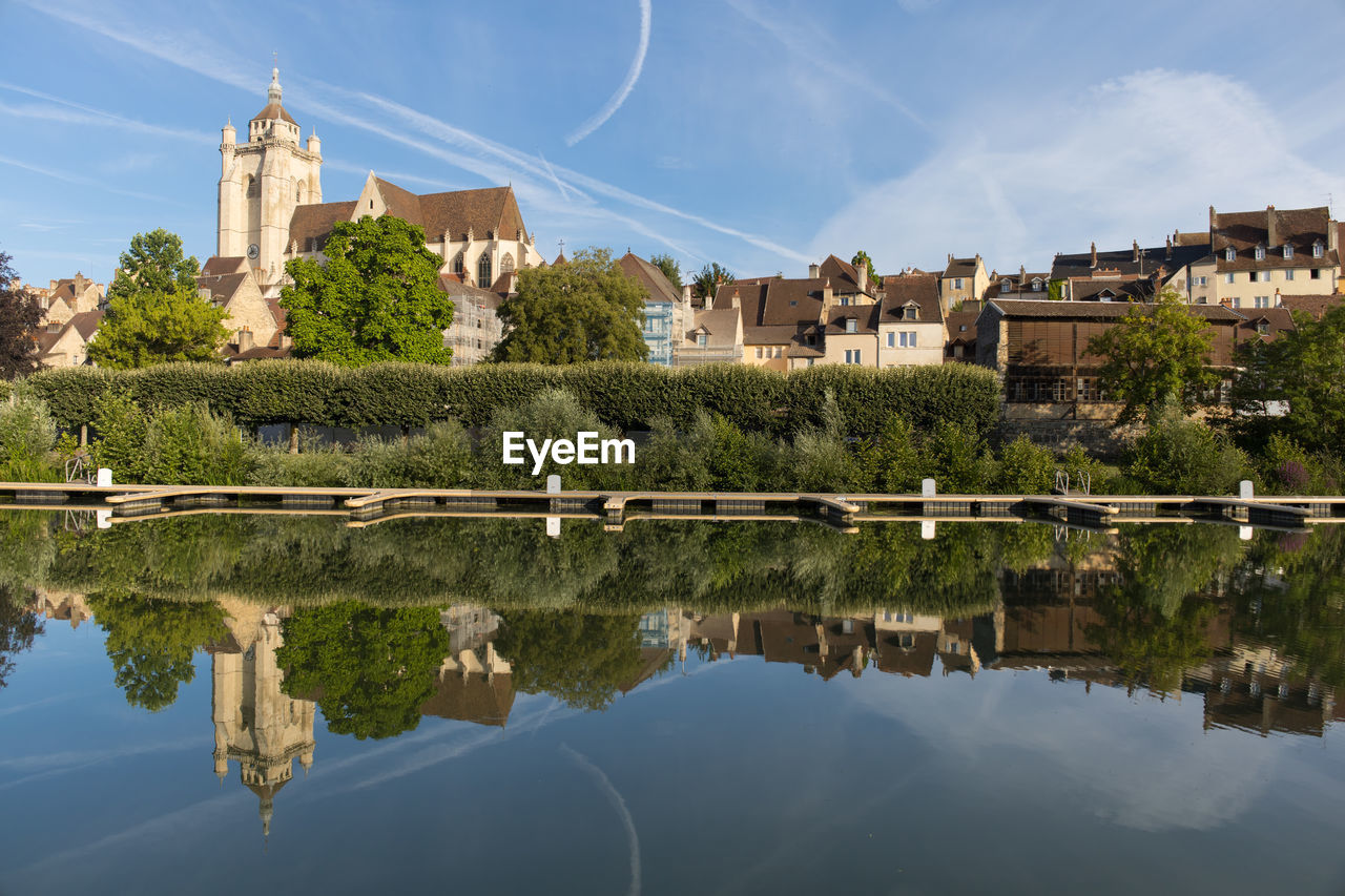 reflection, water, architecture, built structure, building exterior, building, sky, nature, travel destinations, city, cityscape, tree, history, religion, river, travel, the past, no people, blue, plant, house, tourism, landscape, residential district, cloud, place of worship, outdoors, environment, château, landmark, day, reflection lake, waterfront, town, belief, beauty in nature, tower