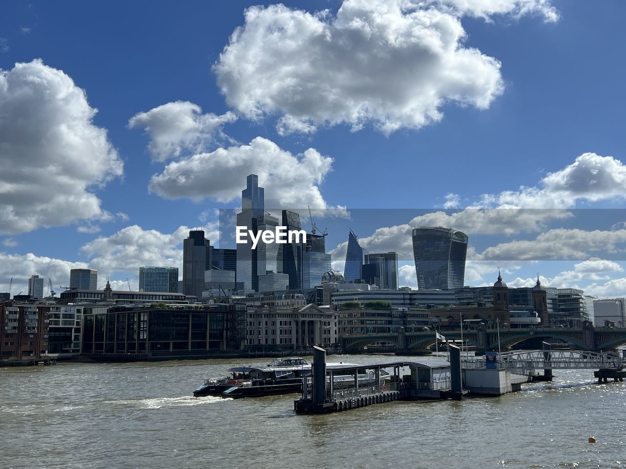 Buildings in city against sky