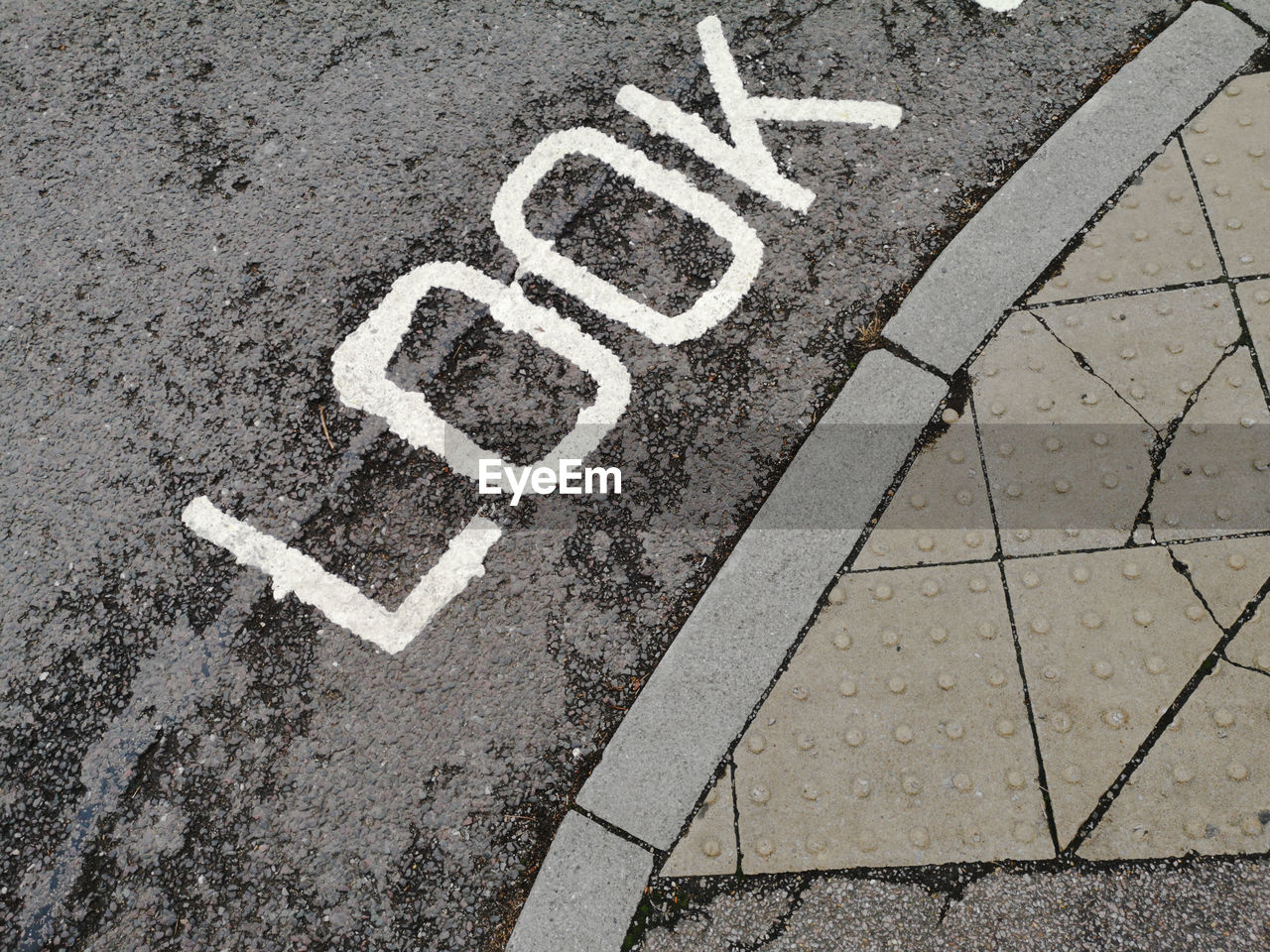 High angle view of warning sign on road