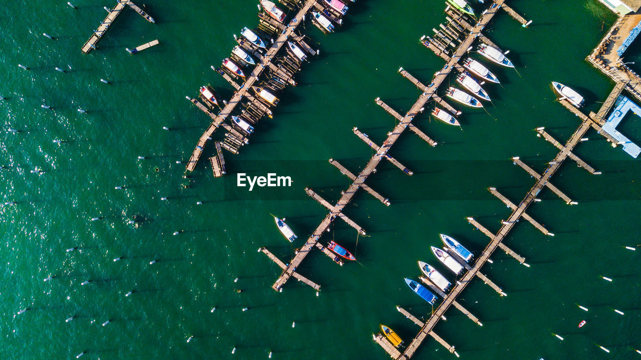 High angle view of boats moored at harbor