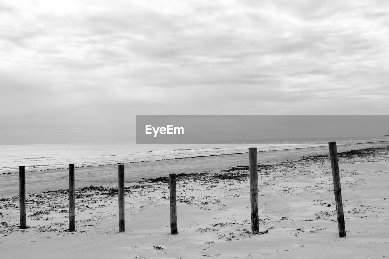 WOODEN FENCE ON BEACH