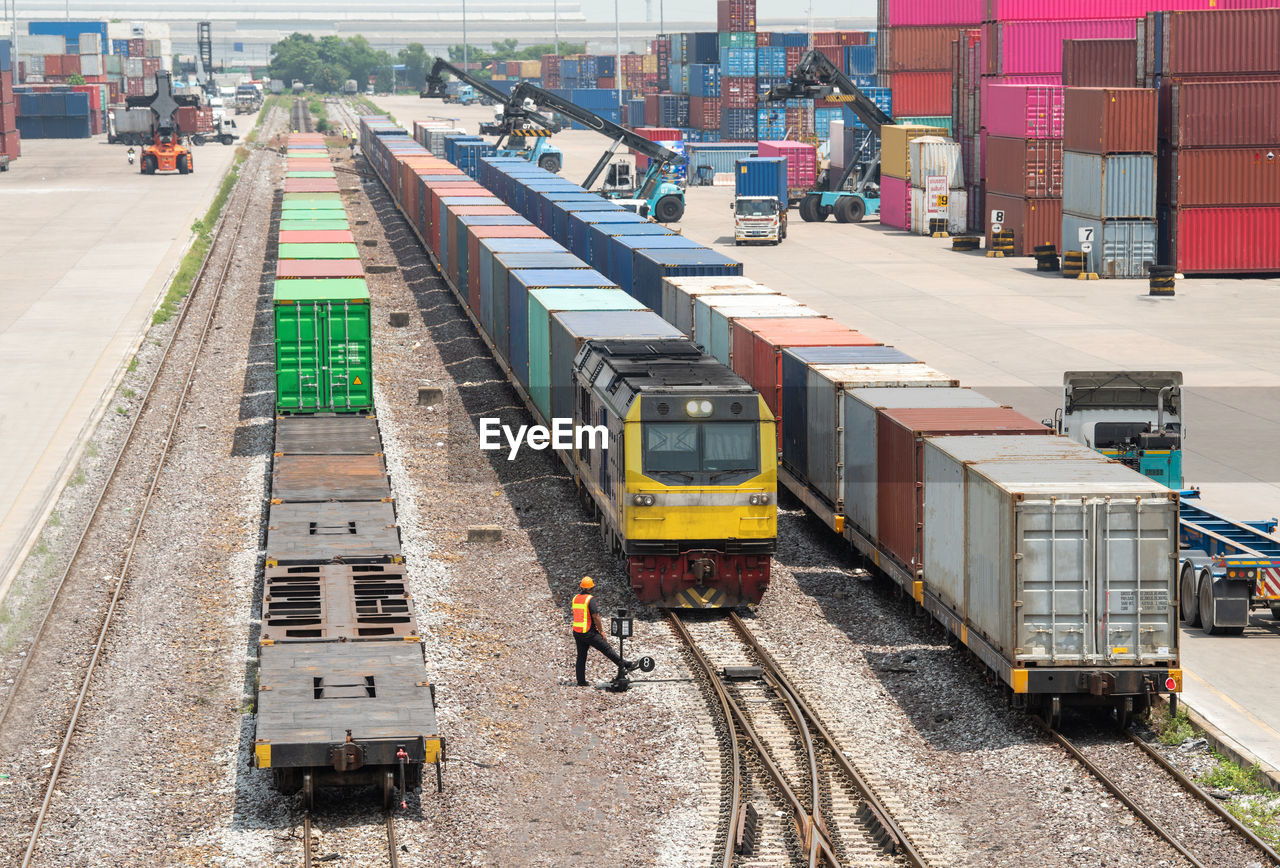 HIGH ANGLE VIEW OF TRAIN AT RAILROAD STATION PLATFORM