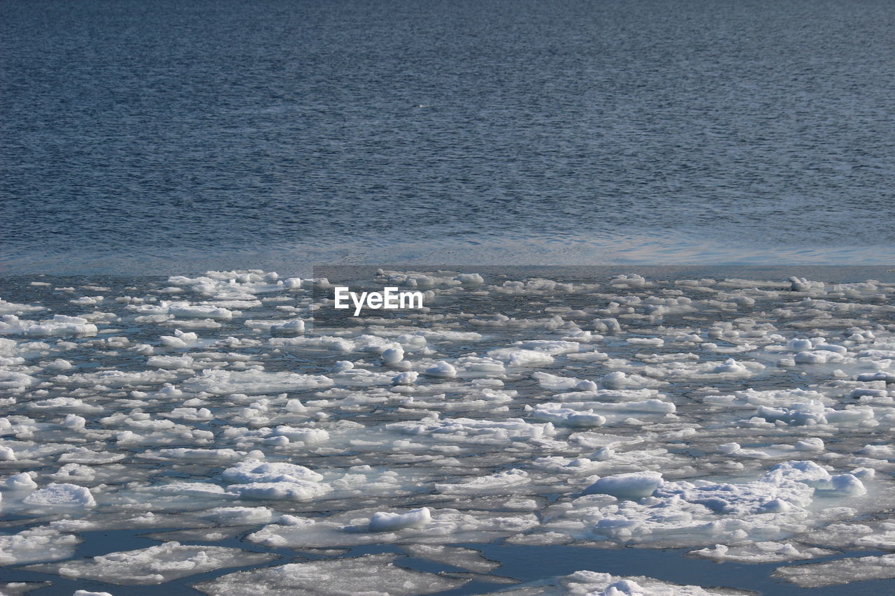 High angle view of sea shore against sky