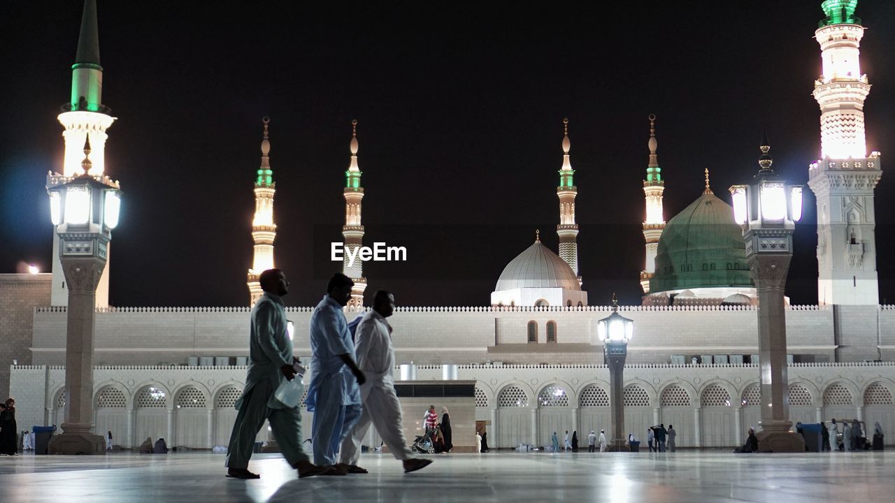 VIEW OF ILLUMINATED BUILDING AT NIGHT