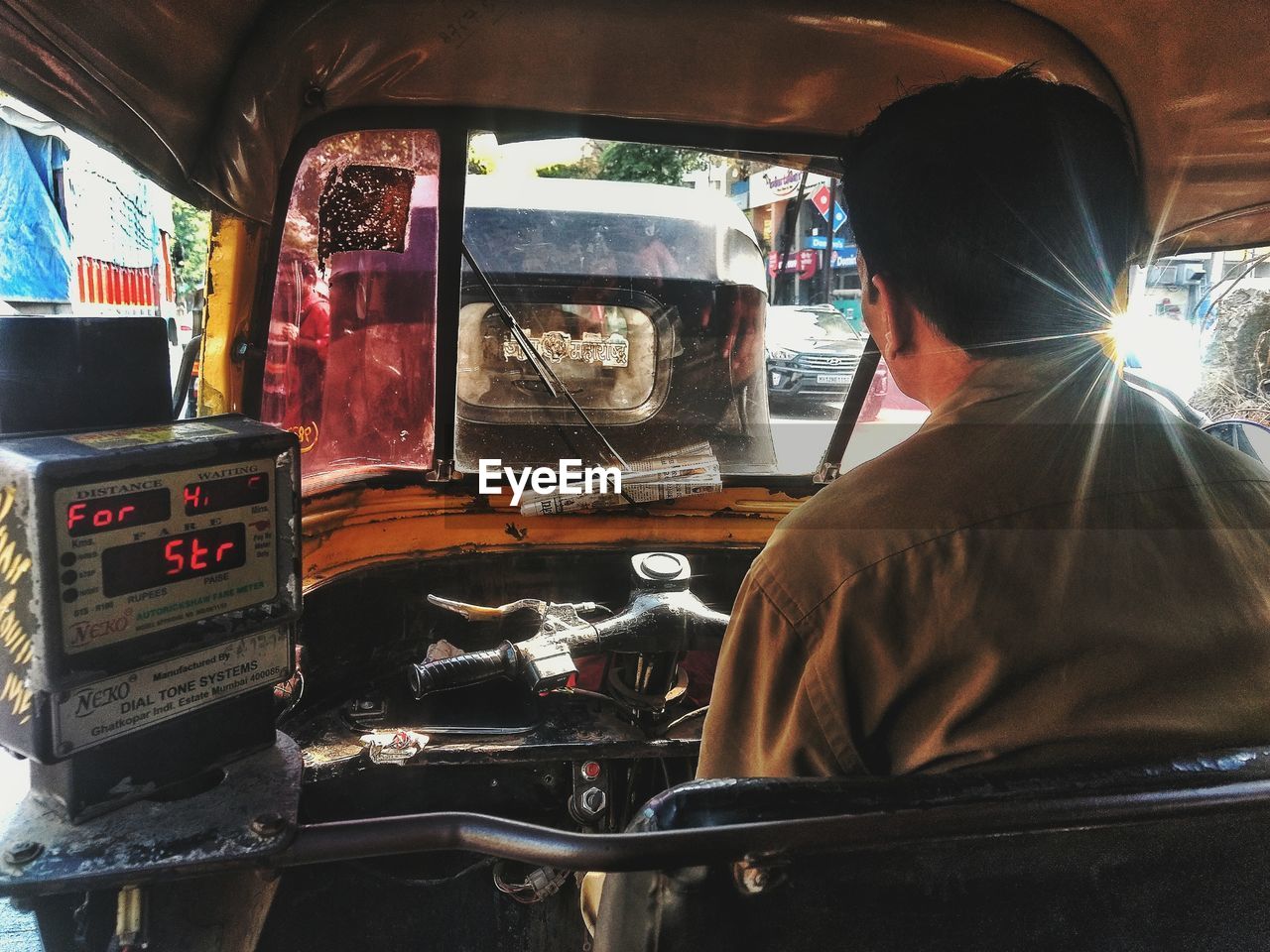 REAR VIEW OF A MAN IN BUS