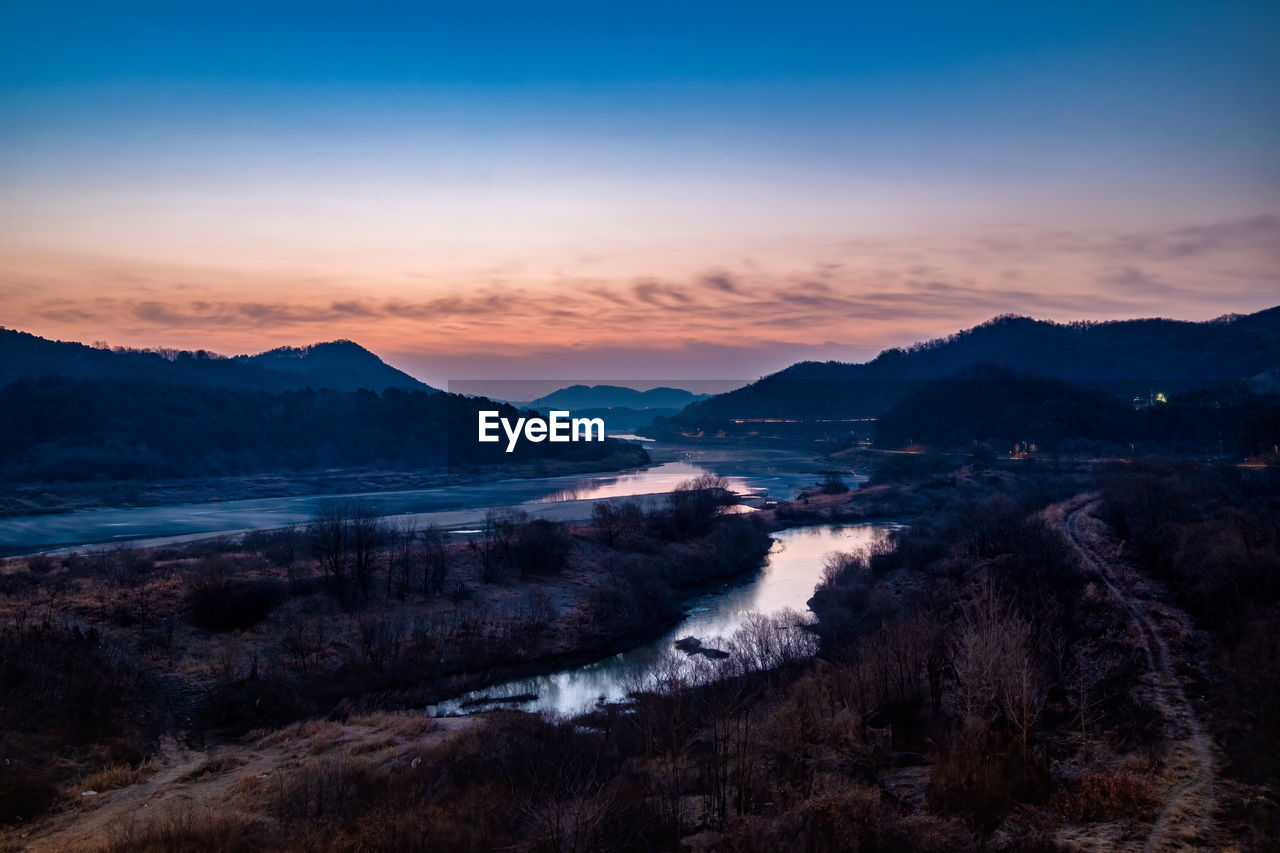 Scenic view of the landscape against sky during sunset