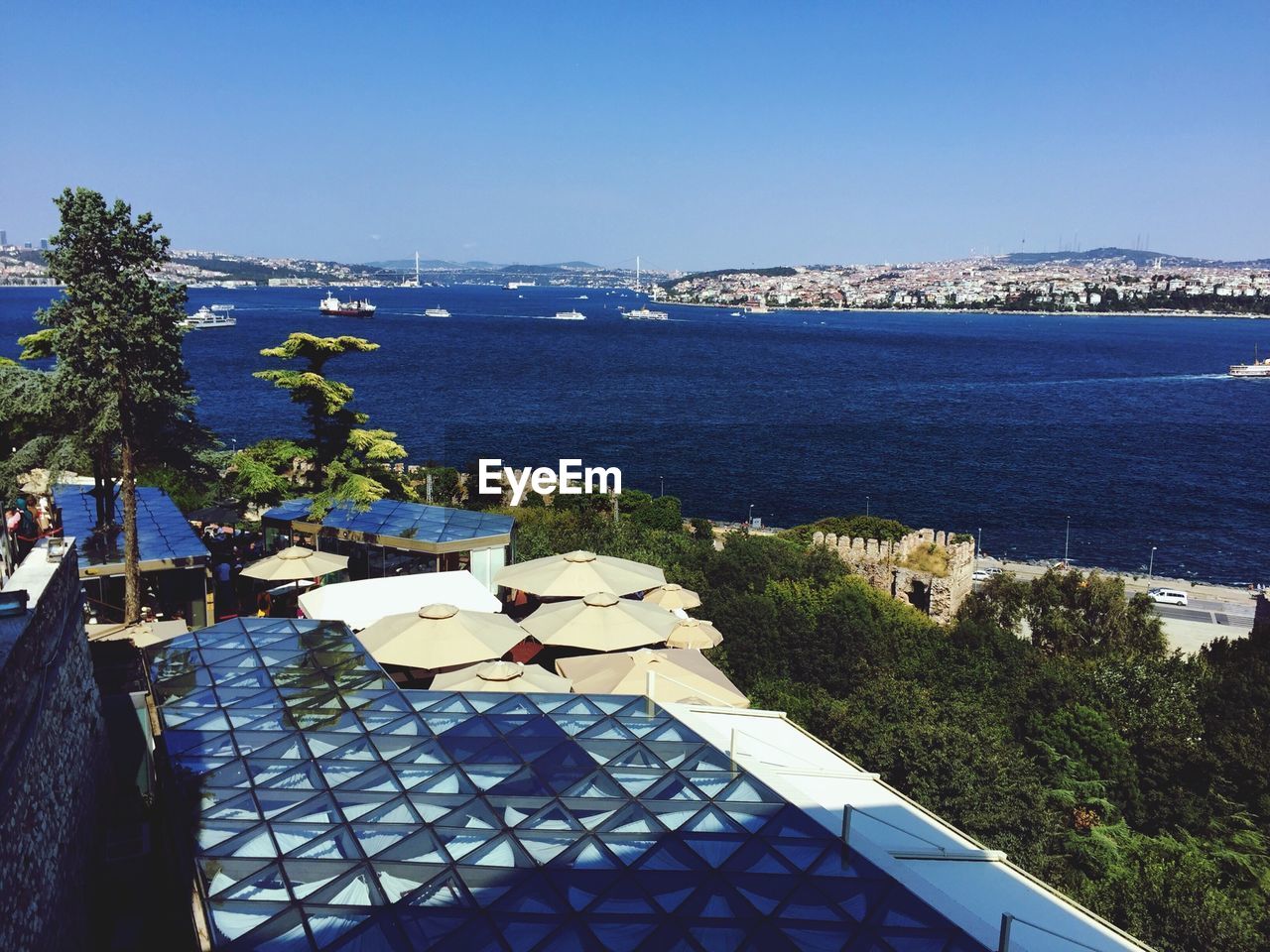 Scenic view of river against clear blue sky