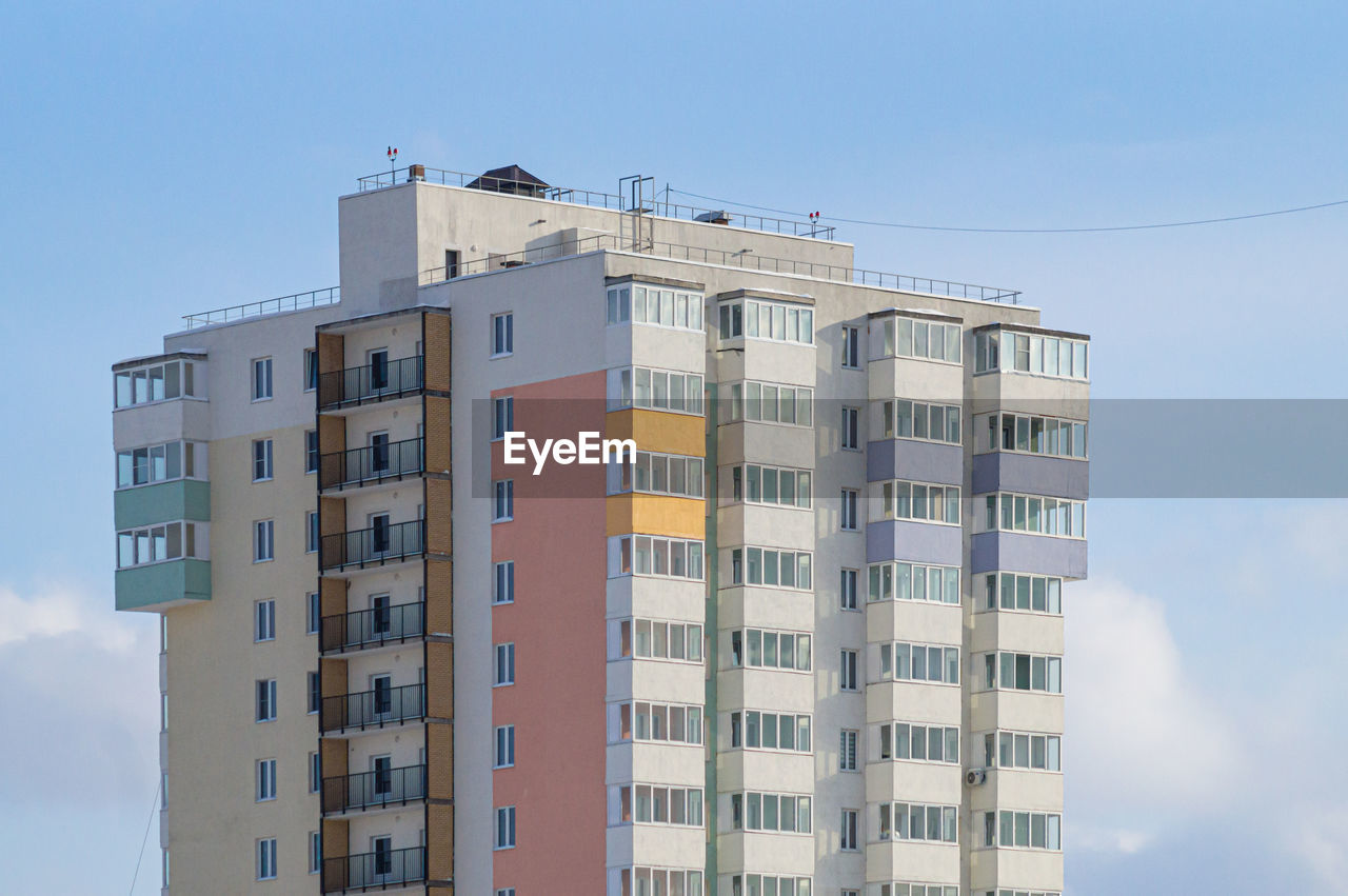 Low angle view of buildings against clear blue sky