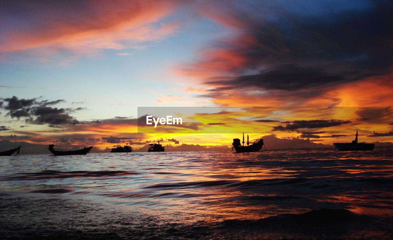sky, water, sunset, sea, cloud, beauty in nature, scenics - nature, nature, evening, horizon, dawn, ocean, afterglow, beach, land, silhouette, orange color, shore, nautical vessel, tranquility, wave, coast, tranquil scene, outdoors, idyllic, seascape, travel, transportation, travel destinations, horizon over water, dramatic sky, wind wave, holiday, motion, environment, vacation, trip