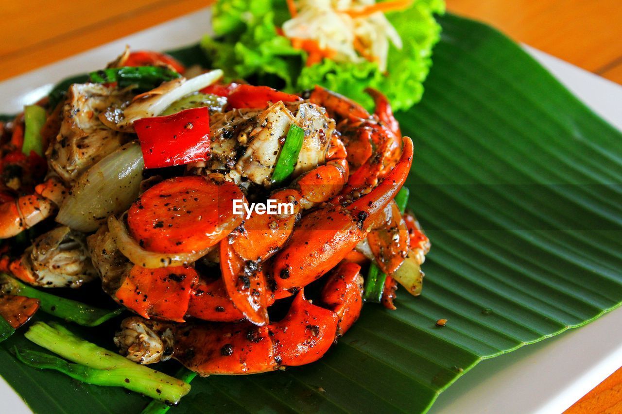 High angle view of fried crab with black pepper